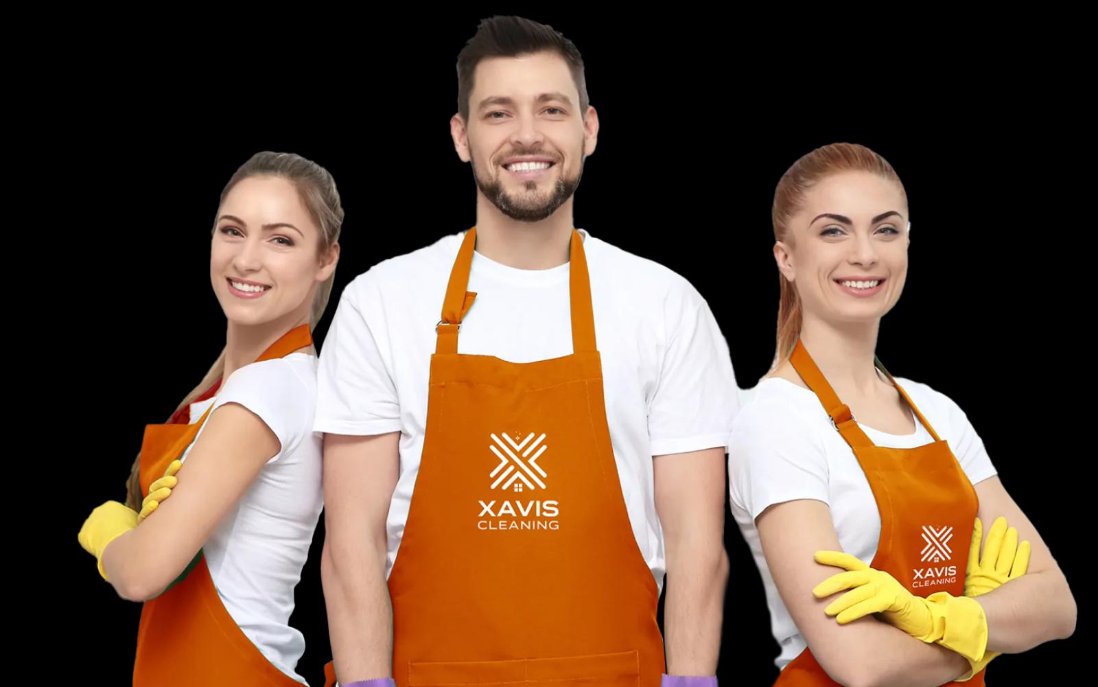 Smiling cleaners in orange aprons and yellow gloves ready to start a clean